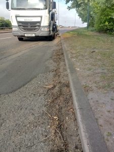 A road sweeper cleaning a slipway on the A180.