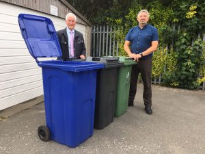 Pictured are Cllr Stewart Swinburn and Chris Dunn, deputy head of operations, with the two new bins and one of the existing green bins.