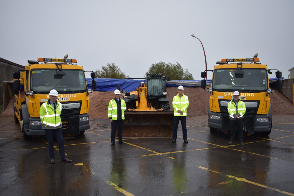Councillor Swinburn and ENGIE officers stand with some of the gritters gearing up for the winter.