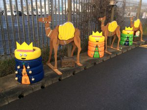A group of three kings made of tyres with three camels from an old school nativity play.