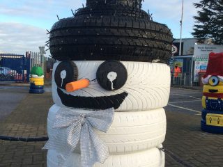 A snowman made of tyres at Grimsby Tip
