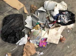 Items found with paper and card recycling including pieces of carpet, black bins bags and a duvet.
