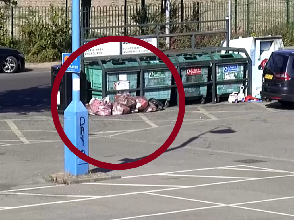 Bags of fly-tipped waste next to recycling bins in Garibaldi Street car park, Grimsby