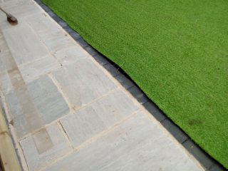 Some of the shoddy fitting of the artificial grass