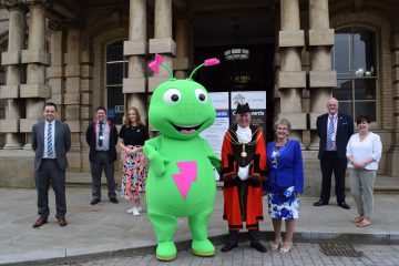 Mayor of North East Lincolnshire poses for a photo with sponsors of the new Civic Awards
