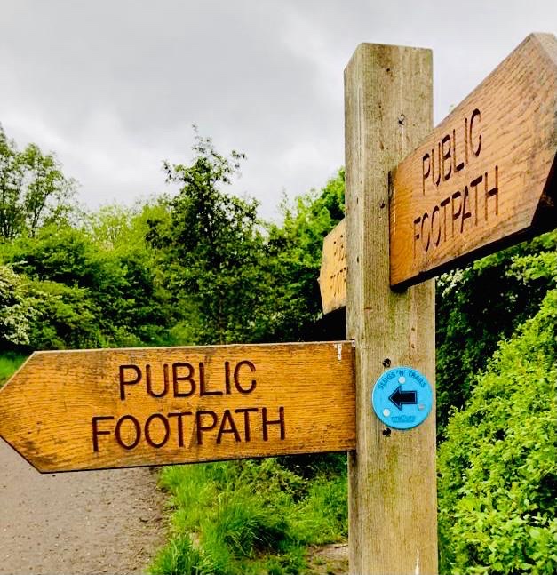 A sign leading the way to a FitRoutes trail