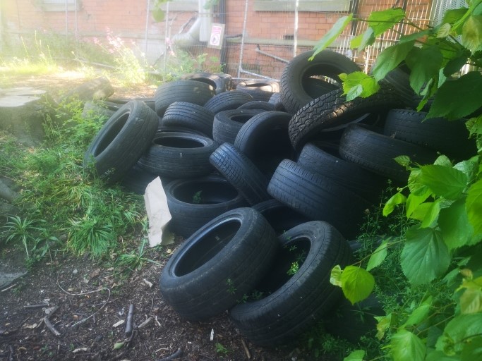 A pile of dozens of illegally dumped tyres in Grimsby.