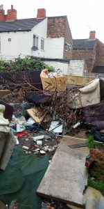 Heaps of waste in a Grimsby garden.