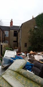 Heaps of waste in a Grimsby garden.