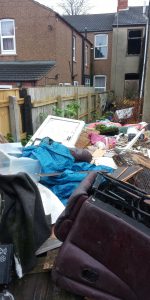 Heaps of waste in a Grimsby garden.