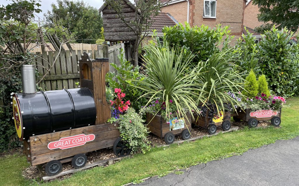 A large model train planted up in Great Coates.