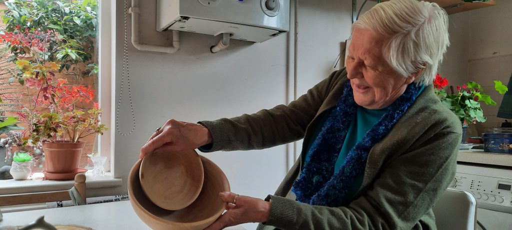 Pam Shreeve with the bowls made from the tree she planted in 1953