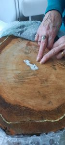 Pam points to the growth ring from when the tree was planted