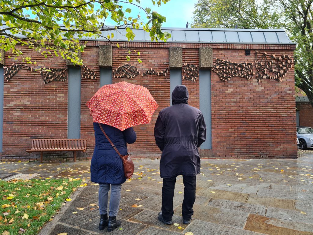 Couple looking at the Murmurations artwork