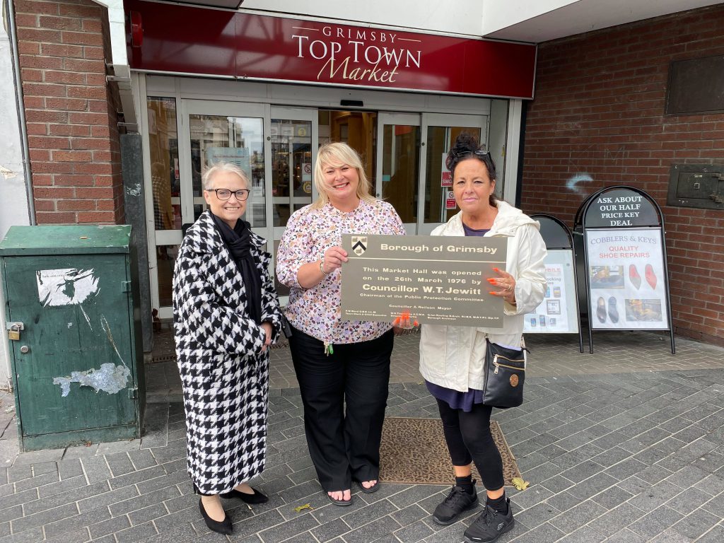 Councillor Debbie Woodward, Ebony Fytche and Susan Gifford with the plaque.