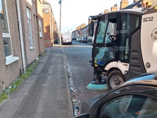 Mini road sweeper cleaning a Grimsby street