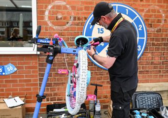 Man fixes a child's bike
