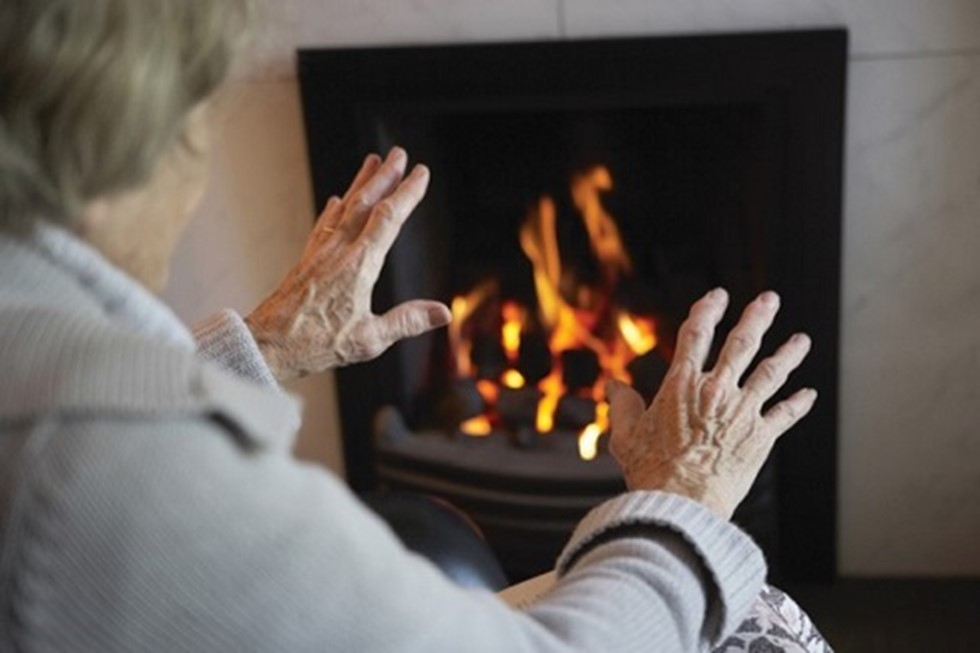 Woman sat in front of fire