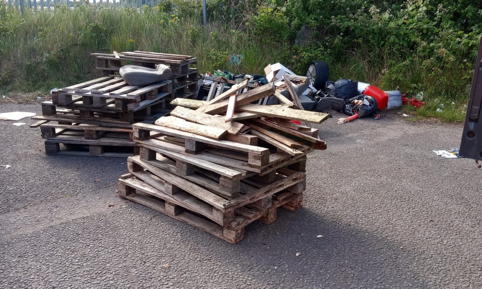 Car parts and wooden pallets flytipped in Grimsby did you see who