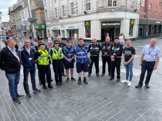 Council members and officers with police and other agencies in Grimsby