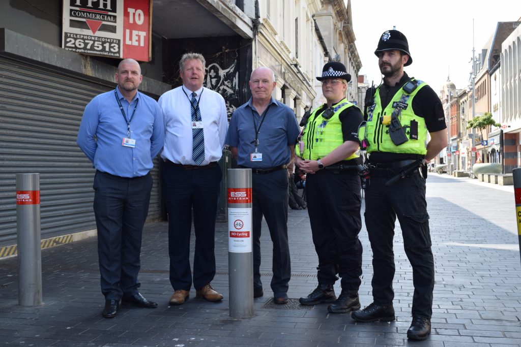 Representatives from the Council and Police assembled for a photo in Grimsby town centre