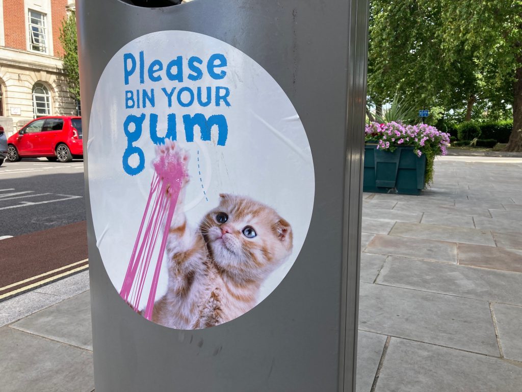 Bin sticker with image of a cat playing with chewing gum