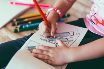 A photo of a child's hands drawing