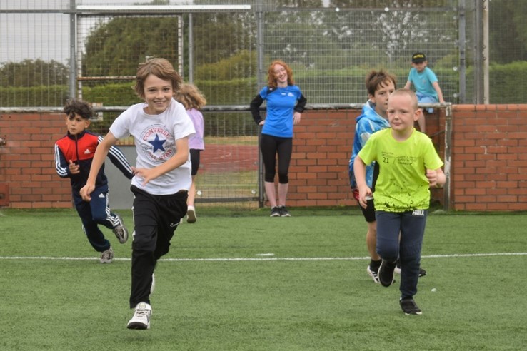 Children in running race during holiday activities