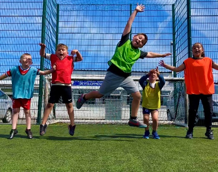 Kids jumping at a holiday activity event