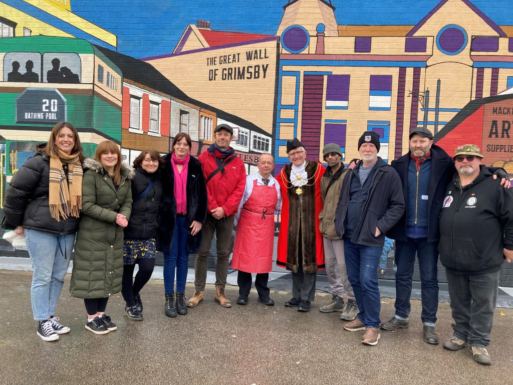 Artists and guests at the unveiling of the Great Wall of Grimsby mural.