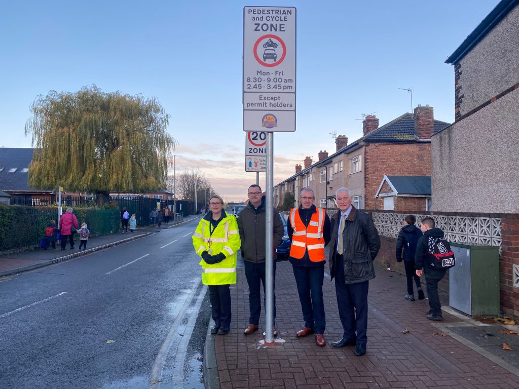 People outside Macauley Primary Academy as School Streets trial launches.