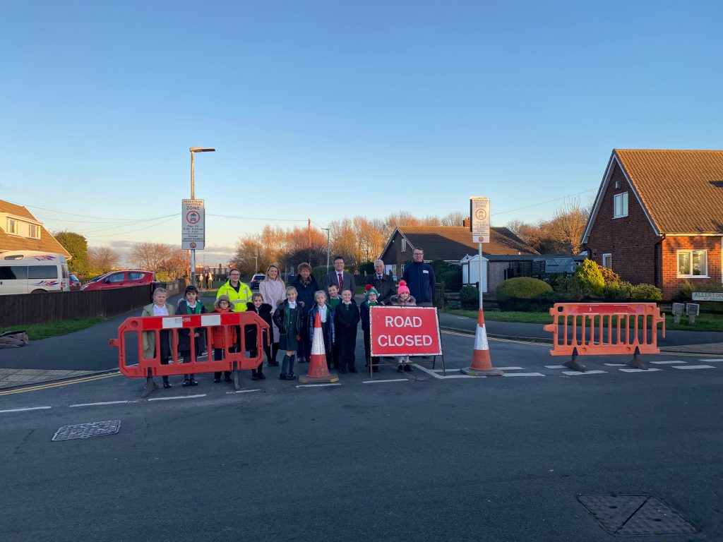 Children and adults outside Pilgrim Academy as School Streets trial launches.