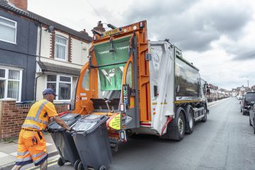 Refuse worker emptying recycling bins in Cleethorpes