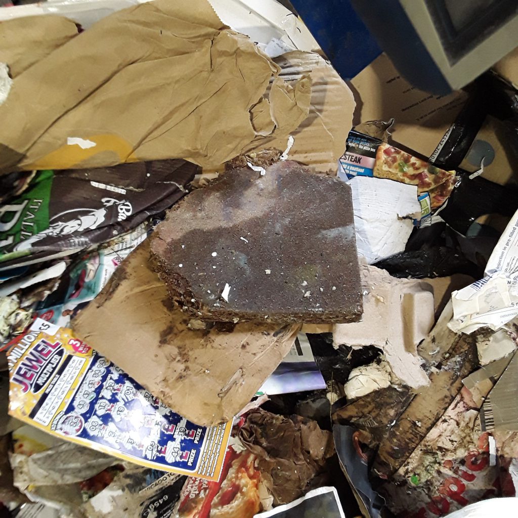 When the paper and card arrived at the recycling plant they found more rubbish that should not have been in there, such as this chipboard.