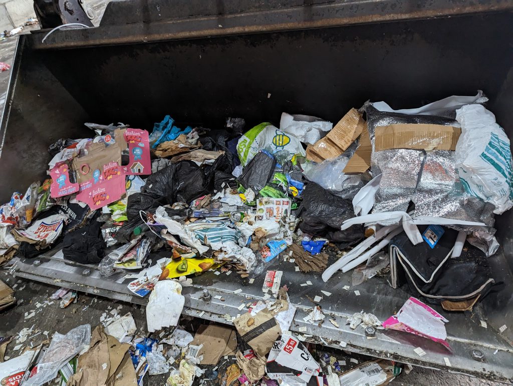 Plastic bags and other items removed from the load of paper and card before it was sent to be recycled.