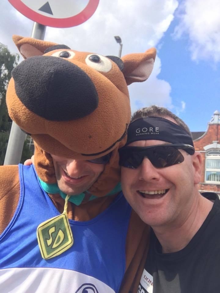 Scott Worboys with a man dressed as Scooby Doo
