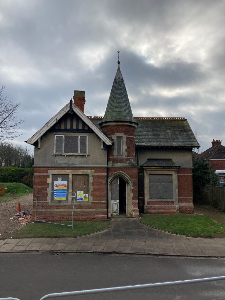 boarded up cemetery lodge