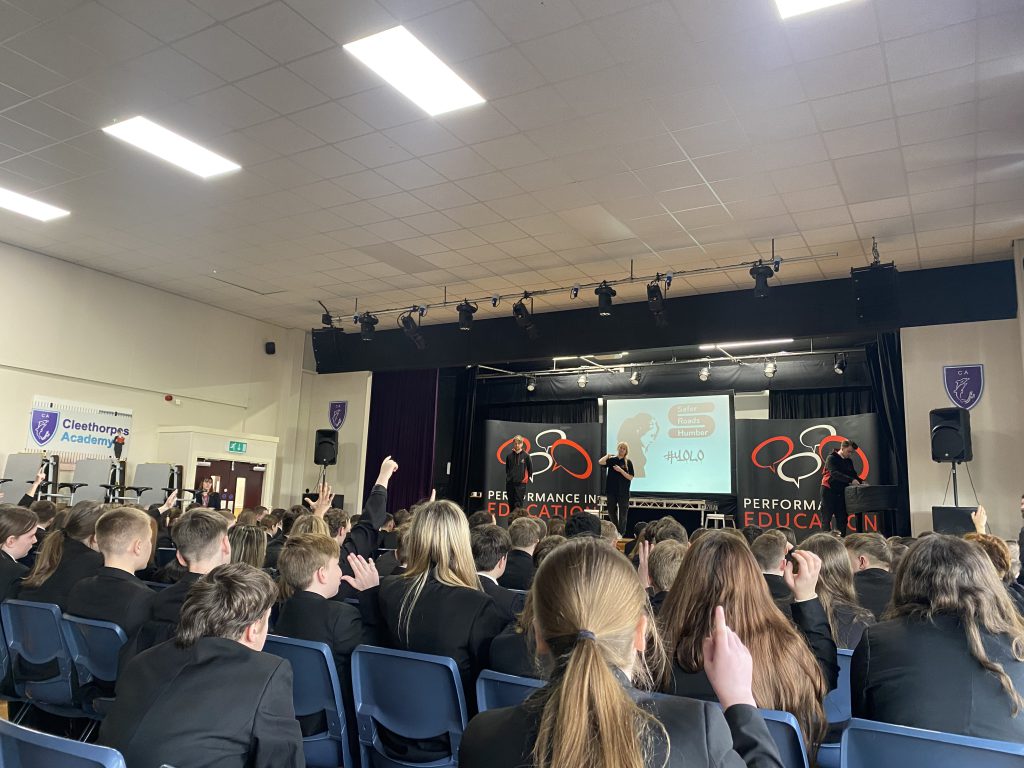 Children watching the road safety play