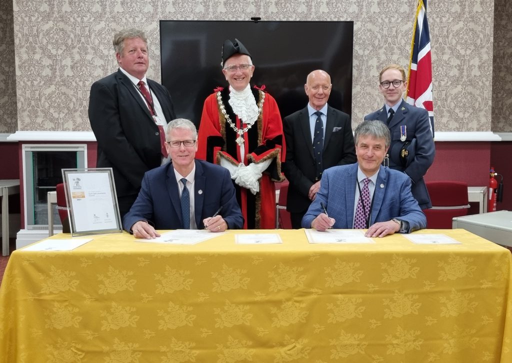 Back row from left: Councillor Ron SHepherd, portfolio holder for safer and stronger communities at North East Lincolnshire Council, Deputy Mayor of North East Lincolnshire, Councillor Steve Beasant, Managing Director of the Armed Forces Major Events Team, Alex Baxter, and Flying Officer Royce Coates RAFAC. Front row from left: Council Chief Executive, Rob Walsh, and Council Leader, Councillor Philip Jackson, sign the Armed Forces Covenant. 