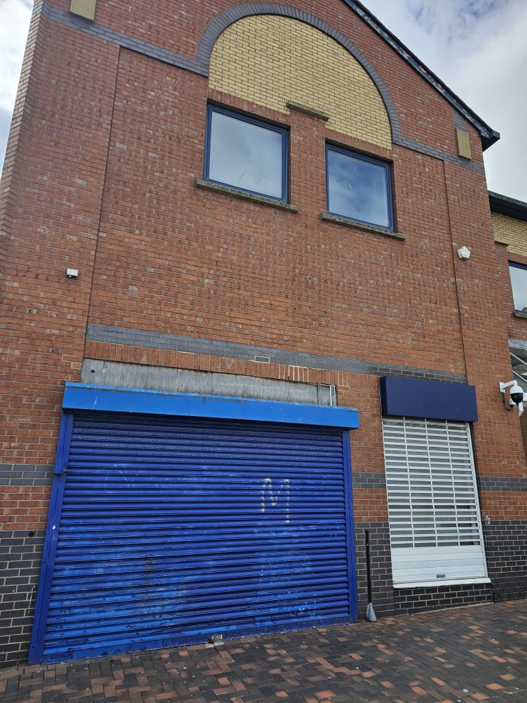 Unkept shop front shutter in Grimsby