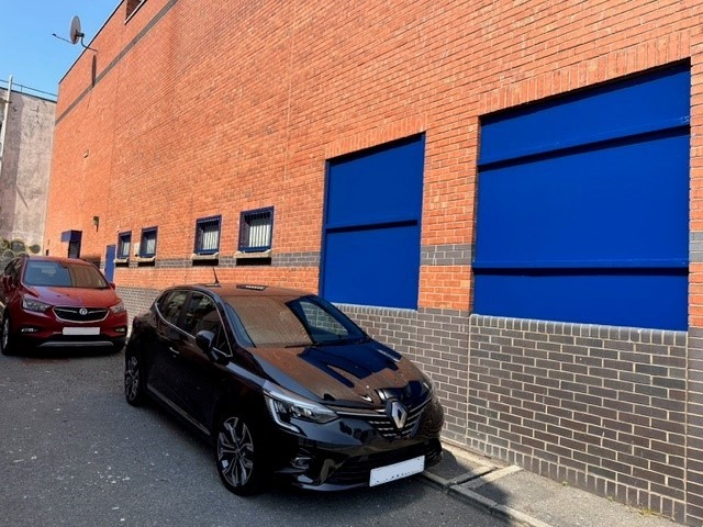 Newly painted shutters at the side of a shopping centre in Grimsby