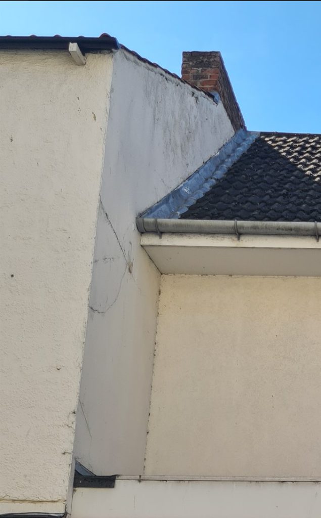 Cracked render on a Grimsby shop front