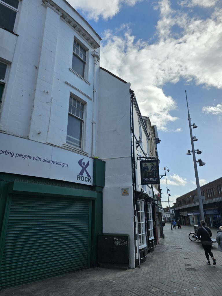 Repaired and freshly painted render on a Grimsby pub