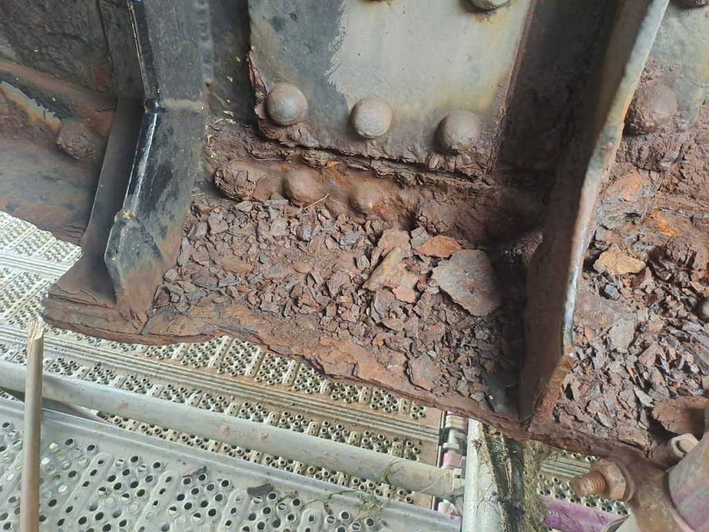 Corrosion to underside of bridge structure.