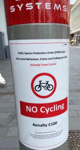 A sign warning people about cycling rules in Grimsby town centre