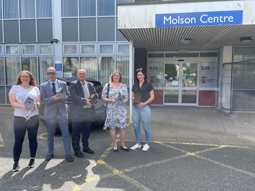 A photo of Councillors posing with bird boxes