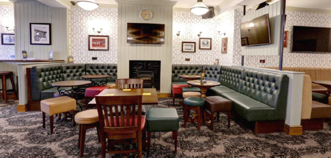 The OId Post Office, Byker. A view of table and chairs inside.