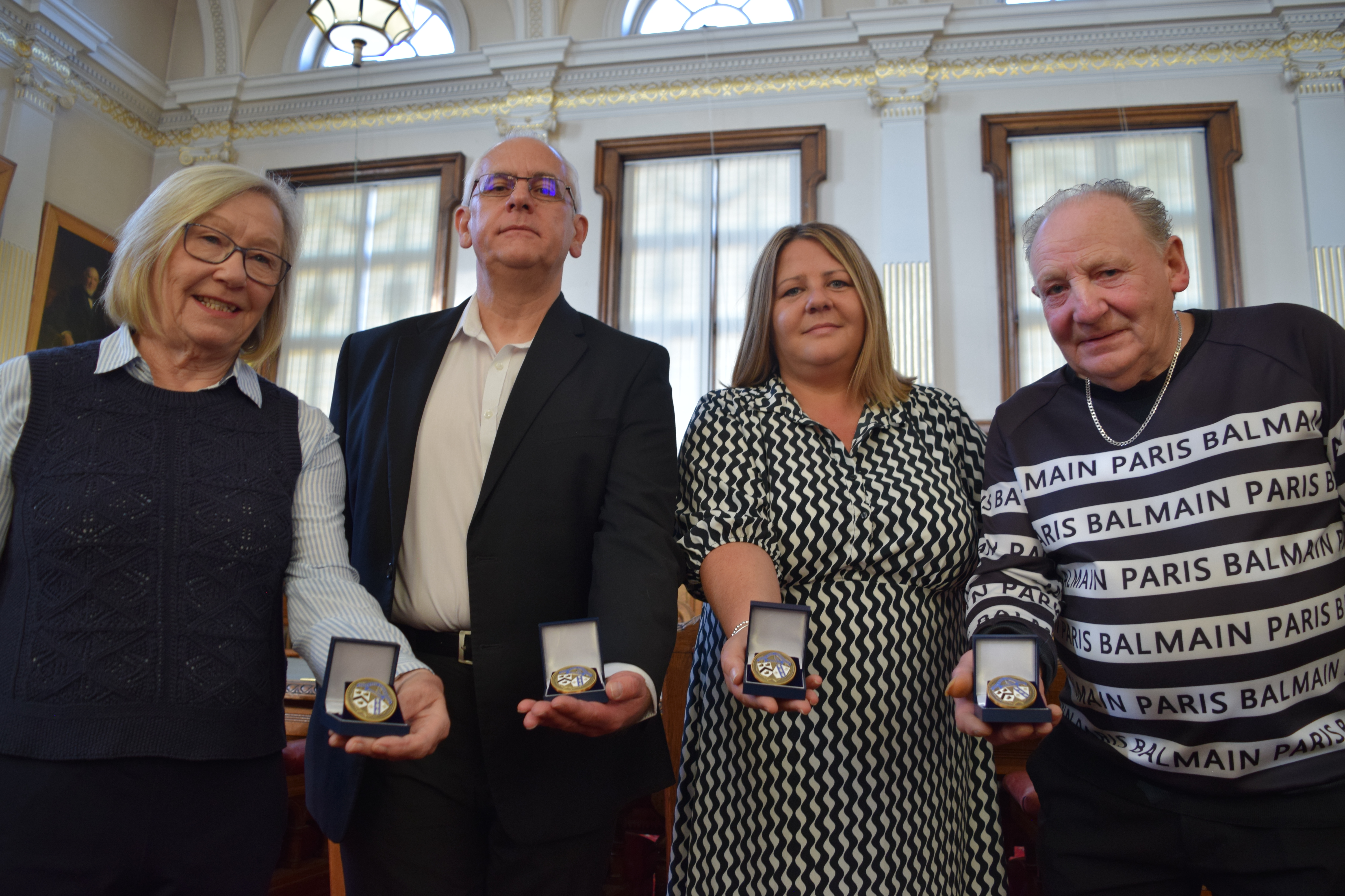 A photo of past award winners and judges