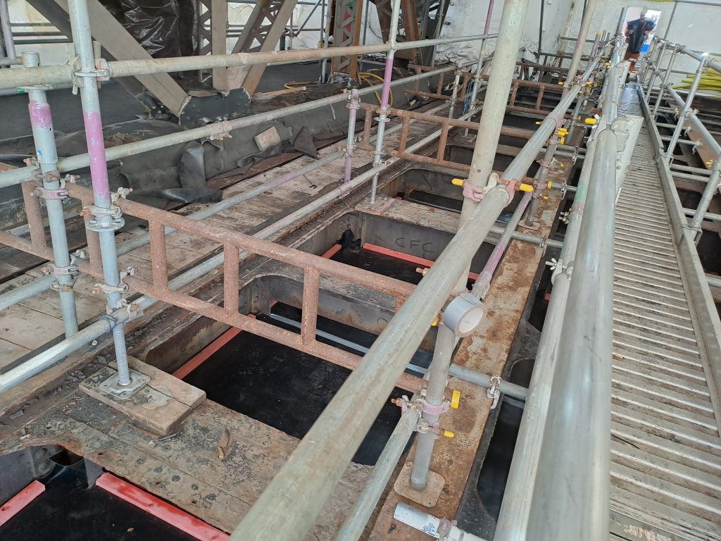 Shows scaffolding works to the lifting span to allow safe crossing and access