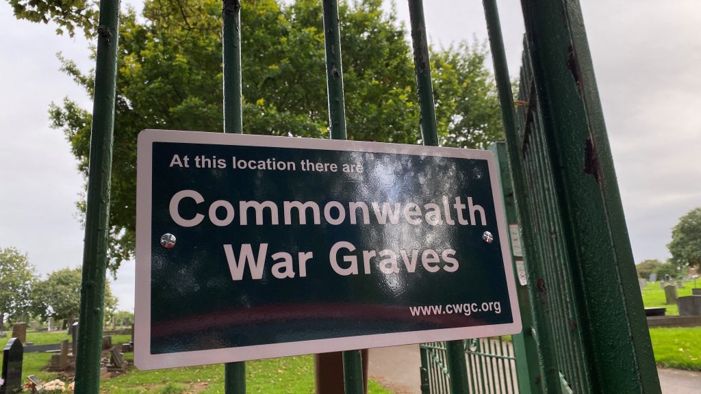 Commonwealth War Graves sign on iron railings